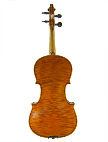 The back of an old Bohemian violin labeled Gio Bapt. Grancino